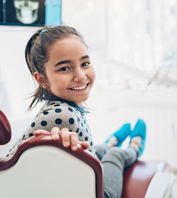 little girl smiling in dentist office