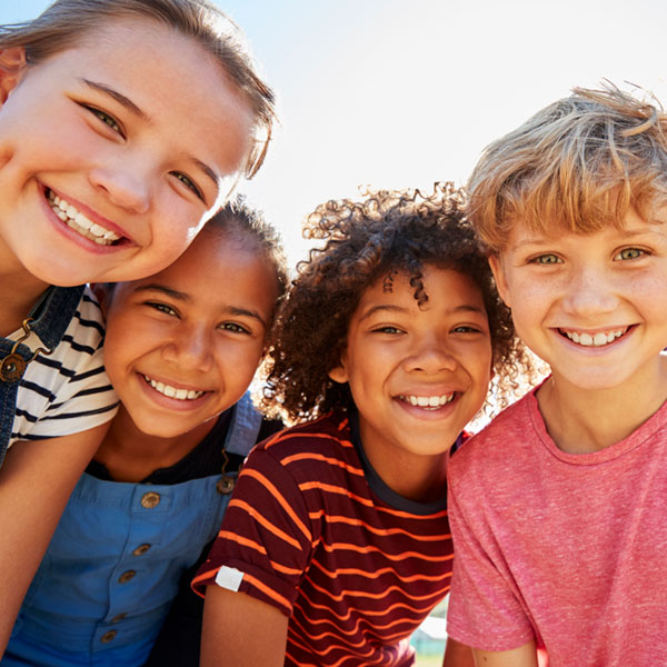group of kids smiling together